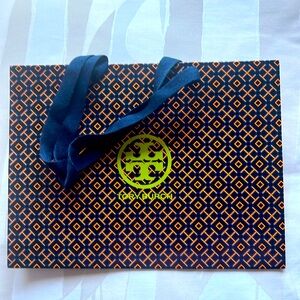 TORY BURCH PAPER BAG. 12 by 9 by 5 inches. Blue handles.